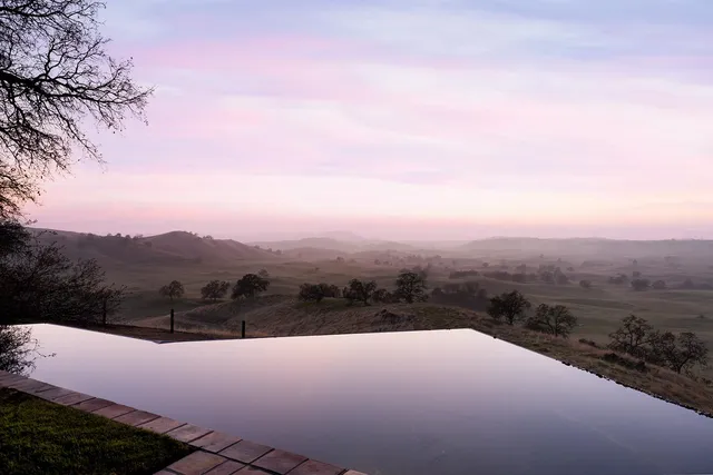 a view of a backyard with sitting area