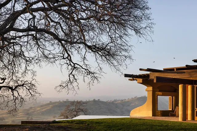 a view of a dining room with furniture and a window