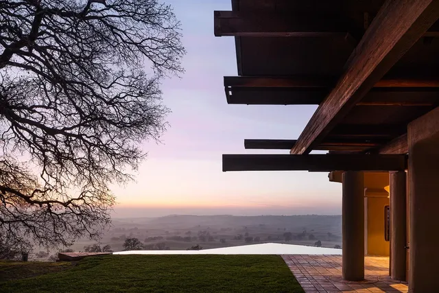 a view of a back yard from a corridor
