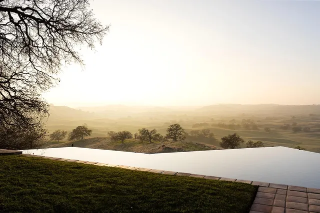 a view of a swimming pool with a lake