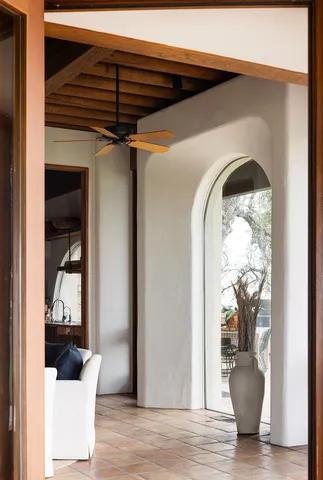 a view of a green field with mountains in the background