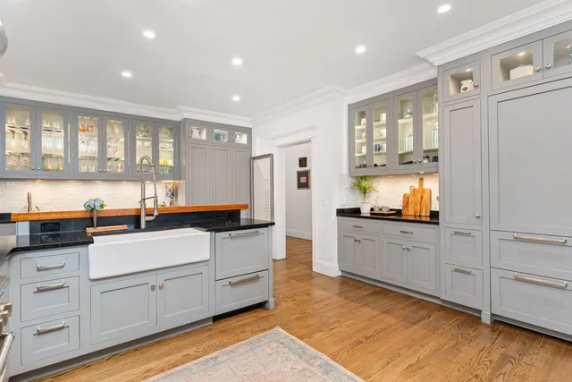 a kitchen with stainless steel appliances granite countertop a stove and a refrigerator