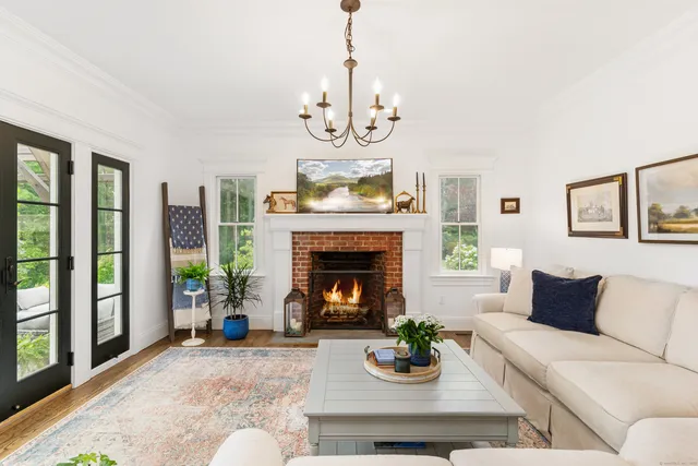 a living room with furniture or outdoor view and a chandelier