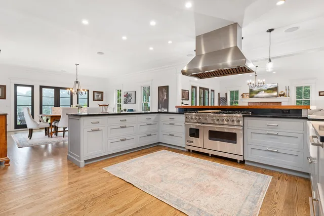 a view of a workspace with furniture and a potted plant