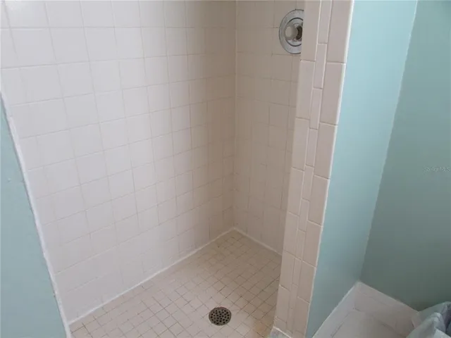 a bathroom with a granite countertop sink