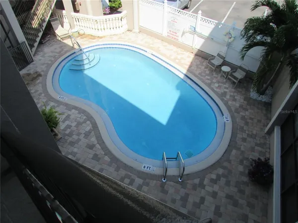 a view of a swimming pool with a fireplace