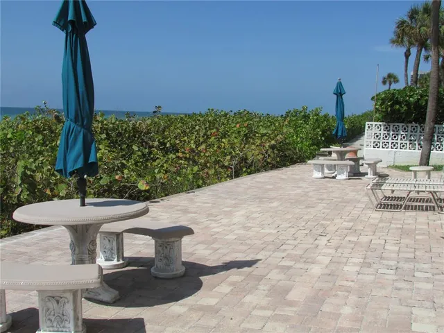 a couple of table and chairs in the patio