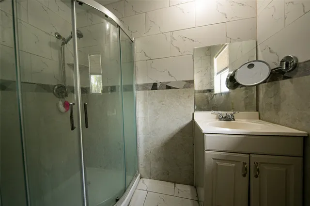 a bathroom with a sink and mirror