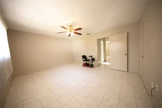 a view of a livingroom with a couch and a chandelier