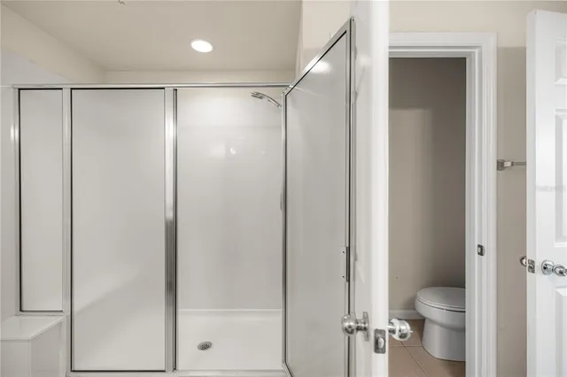 a bathroom with a shower and a toilet