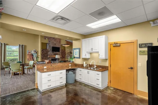 a large kitchen with cabinets and stainless steel appliances
