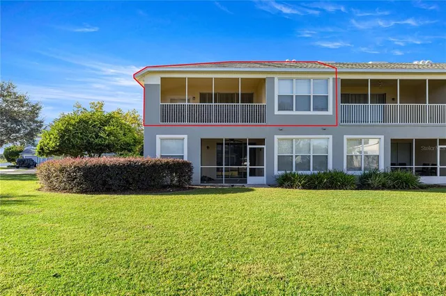 a view of a building with a yard