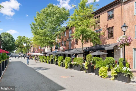 a view of a street with sitting area