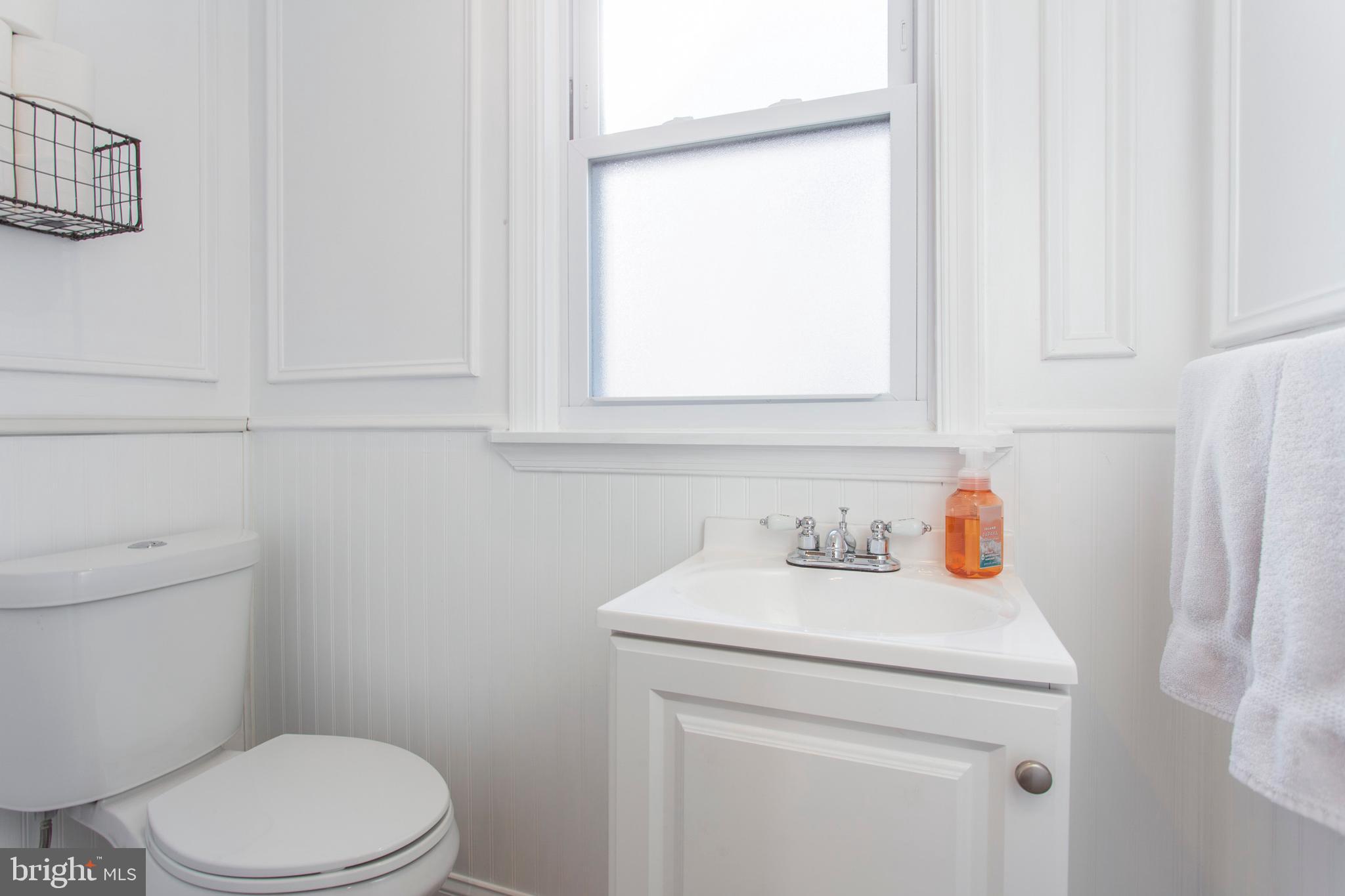 1025 Edgerton Road Secane, PA 19018 - Photo 7 of 21 a bathroom with a sink a toilet and a window