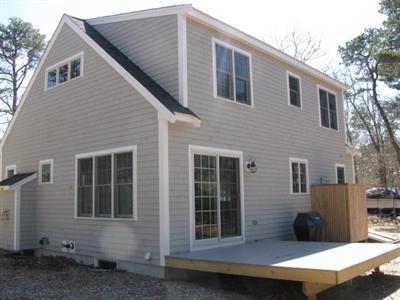 960 Samoset Road Eastham, MA 02642 - Photo 4 of 5 a front view of a house with a garage