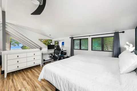 a bedroom with a bed and window