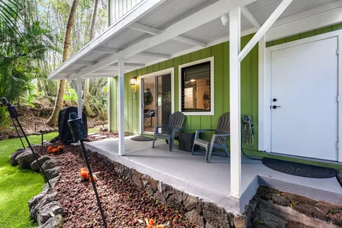 a view of a backyard with furniture