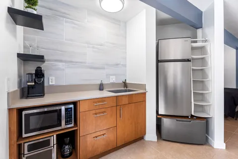 a kitchen with appliances and cabinets