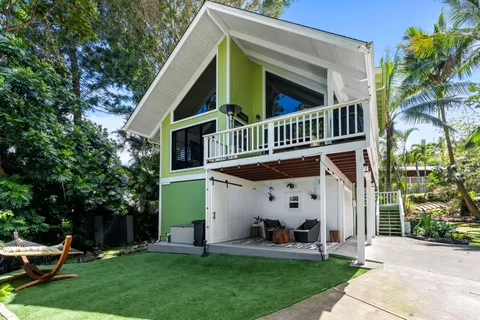 a view of house with yard and entertaining space