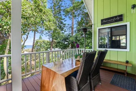 a view of a balcony with furniture