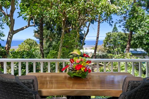 a view of a wooden bench in a back yard