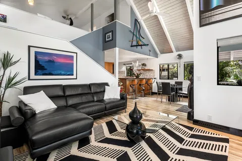 a living room with furniture and a rug