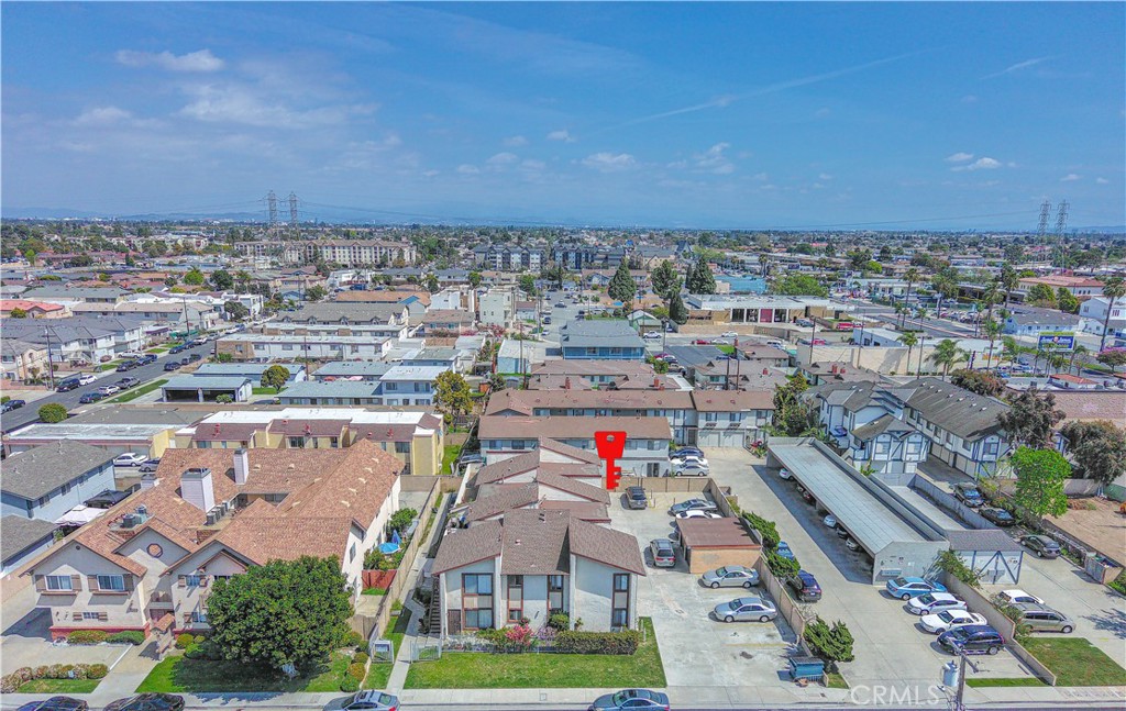 an aerial view of residential houses with yard