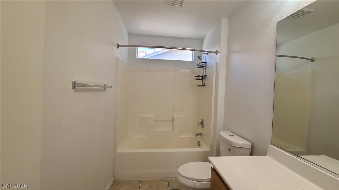 8944 Rutherford Grove Street Las Vegas, NV 89148 - Photo 25 of 35 A well-appointed bathroom offers a clean tub-shower combination, ideal for unwinding.