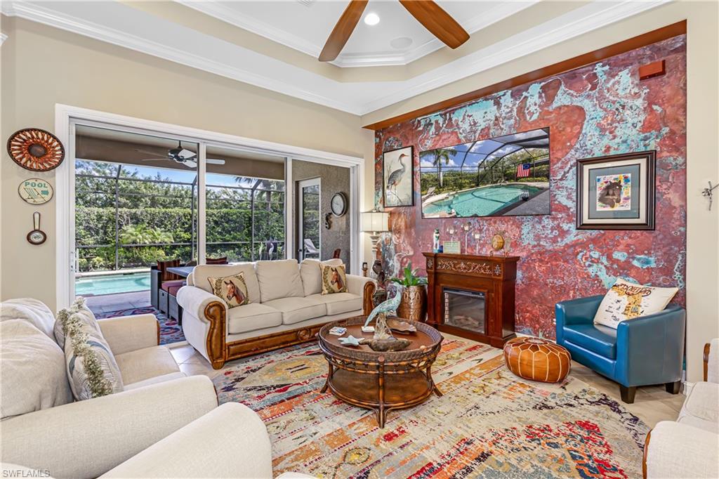 12567 Grandezza Circle Estero, FL 33928 - Photo 11 of 47 a living room with furniture fireplace and flat screen tv