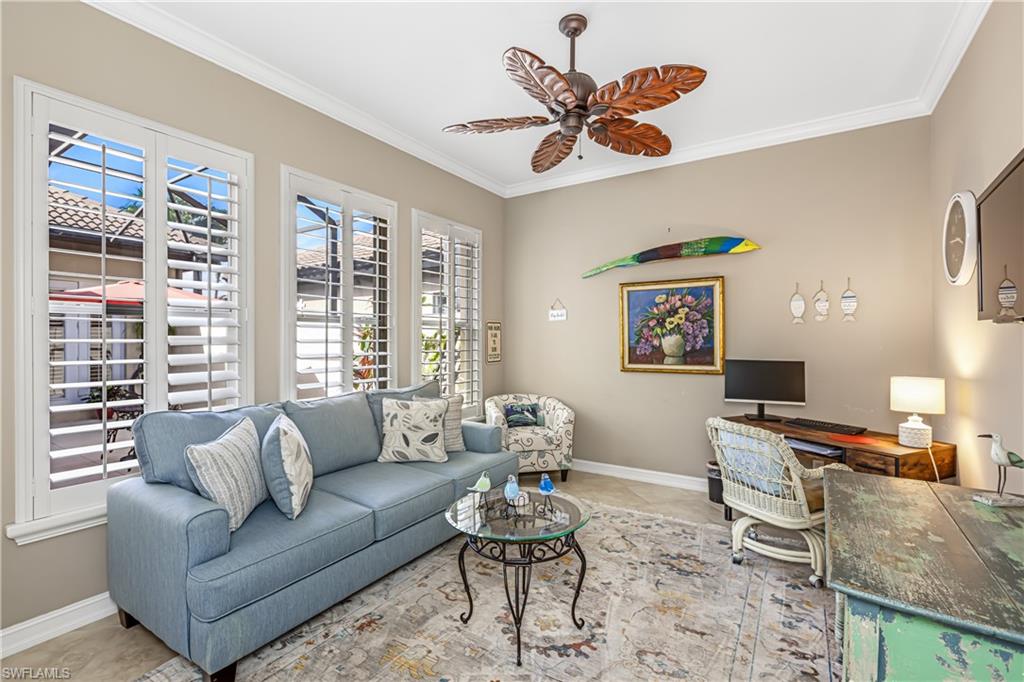 12567 Grandezza Circle Estero, FL 33928 - Photo 19 of 47 a living room with furniture and a large window