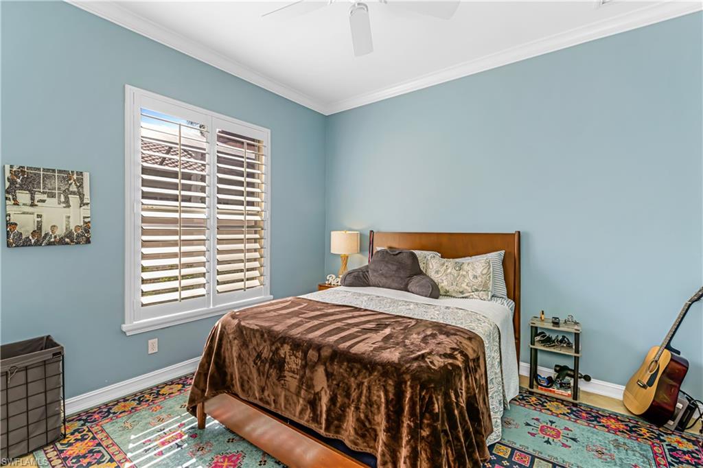 12567 Grandezza Circle Estero, FL 33928 - Photo 20 of 47 a bedroom with a bed and a window