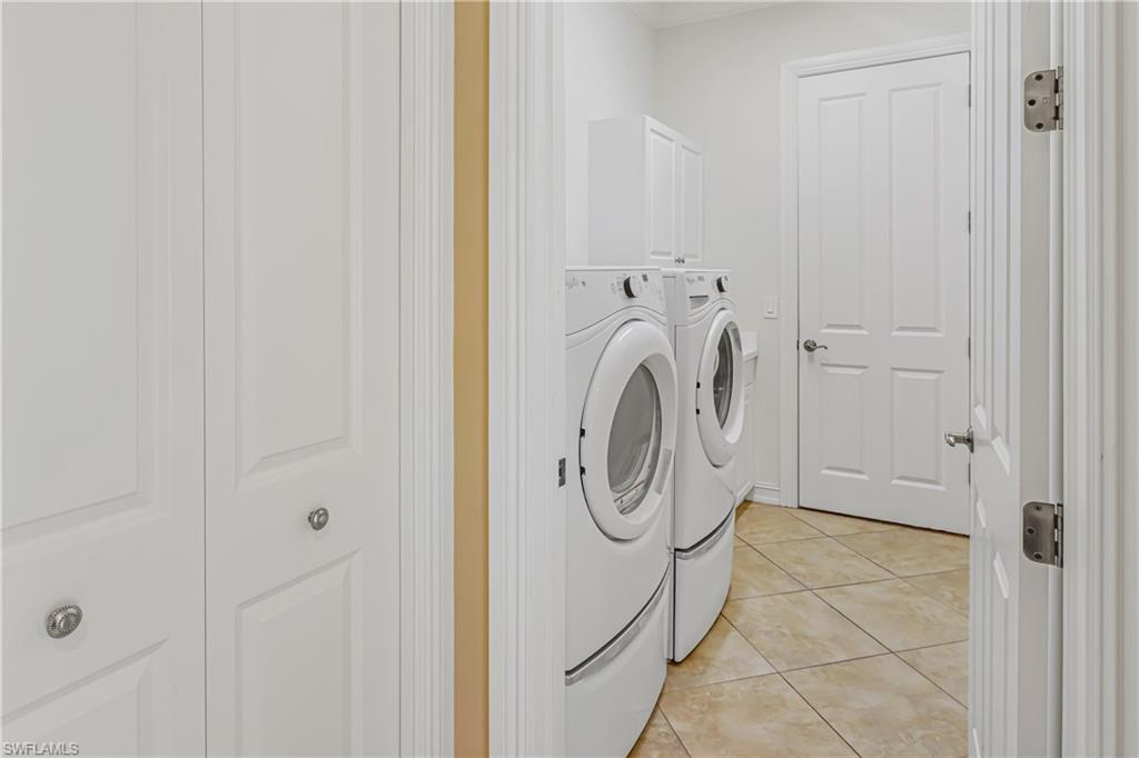 12567 Grandezza Circle Estero, FL 33928 - Photo 23 of 47 a utility room with dryer and washer