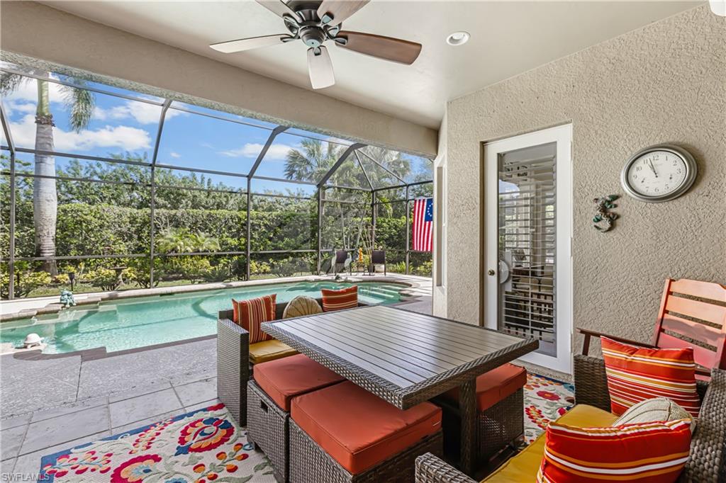 12567 Grandezza Circle Estero, FL 33928 - Photo 24 of 47 a dining room with a table and chairs