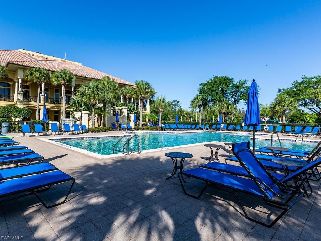 12567 Grandezza Circle Estero, FL 33928 - Photo 29 of 47 a view of a swimming pool with lounge chairs in patio