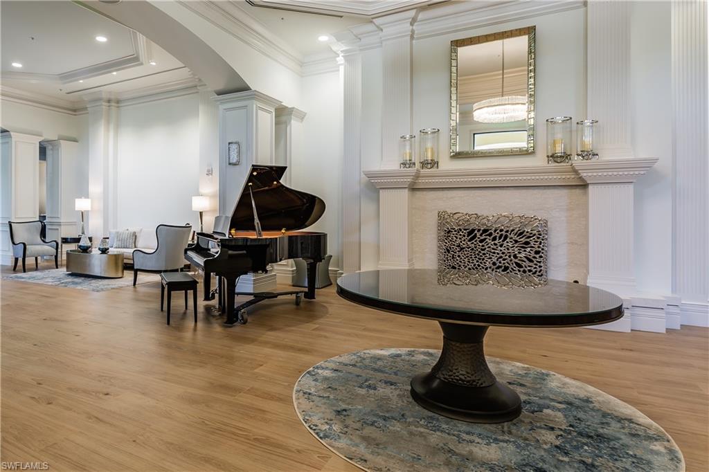 12567 Grandezza Circle Estero, FL 33928 - Photo 31 of 47 a living room with furniture a piano and a fireplace