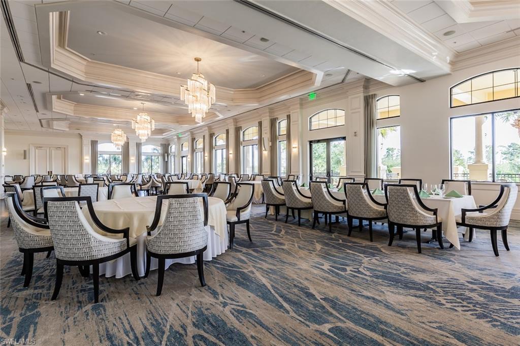 12567 Grandezza Circle Estero, FL 33928 - Photo 34 of 47 a room with lots of chairs and wooden floor