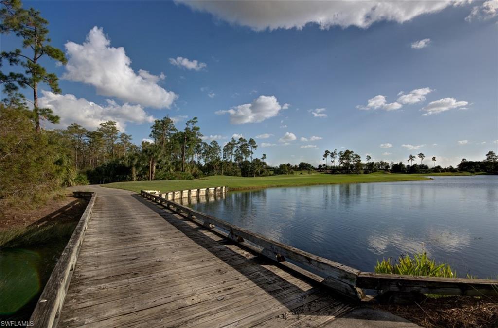 12567 Grandezza Circle Estero, FL 33928 - Photo 40 of 47 a view of a lake with a yard