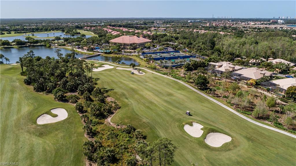 12567 Grandezza Circle Estero, FL 33928 - Photo 42 of 47 a view of a swimming pool with a lot of trees in the background