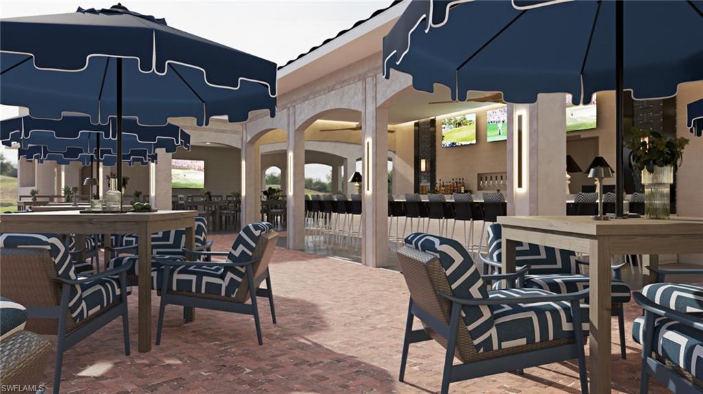 12567 Grandezza Circle Estero, FL 33928 - Photo 44 of 47 a view of a chairs and table in patio with a barbeque