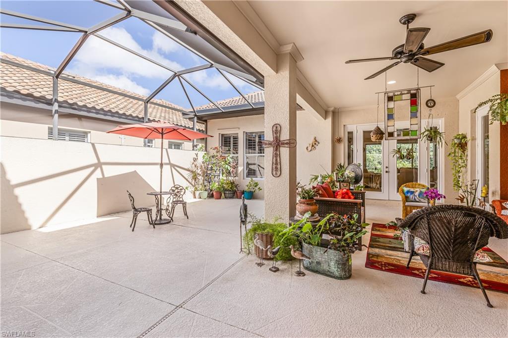 12567 Grandezza Circle Estero, FL 33928 - Photo 6 of 47 a view of a patio with a table and chairs