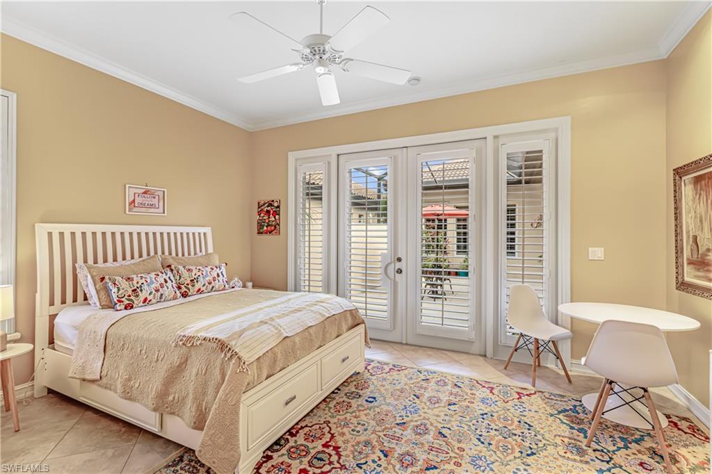 12567 Grandezza Circle Estero, FL 33928 - Photo 7 of 47 a bedroom with a large bed and a window