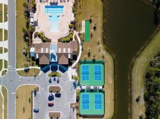 an aerial view of residential houses with outdoor space