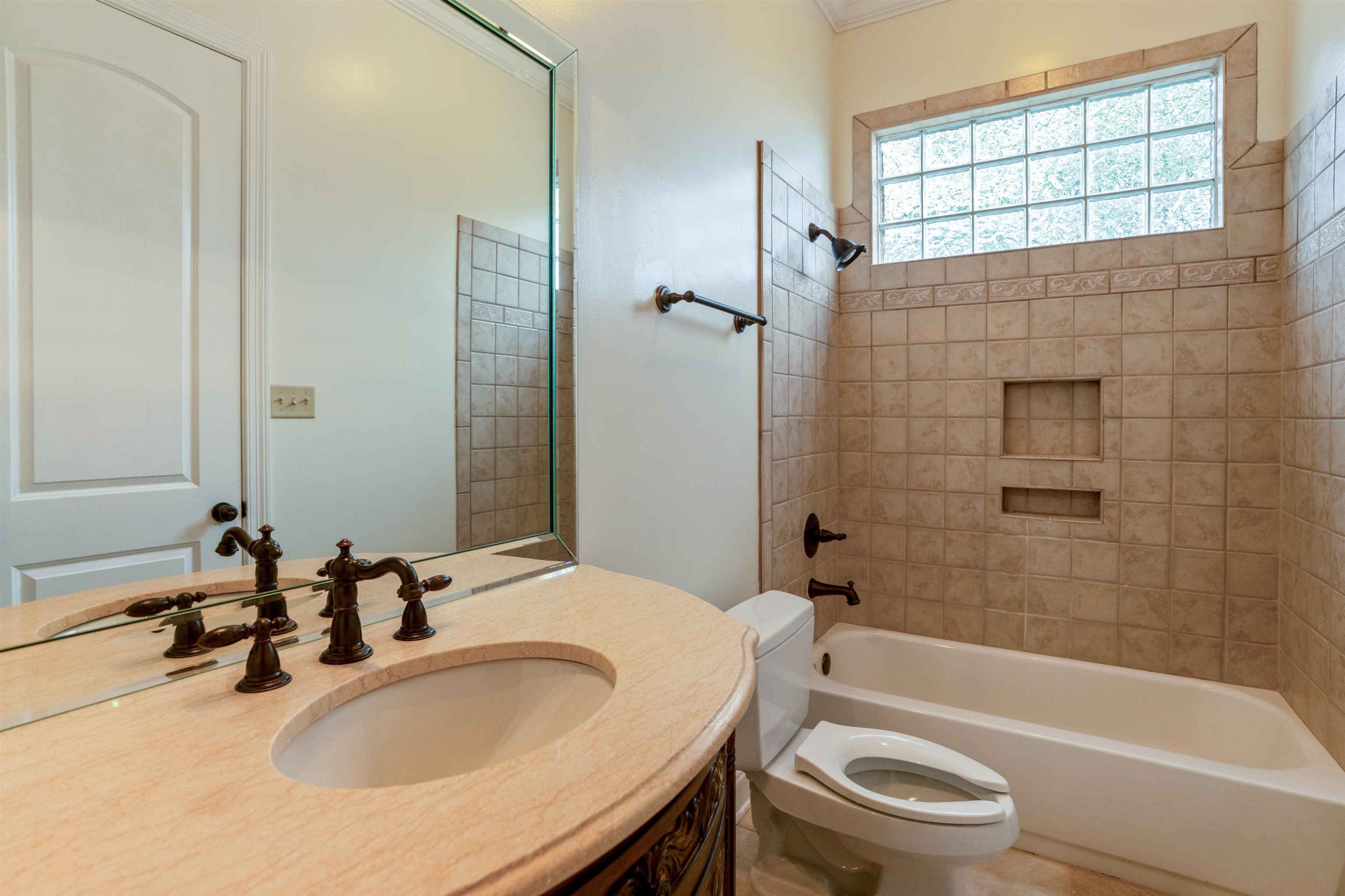 3485 East Taplow Way Collierville, TN 38017 - Photo 15 of 38 a bathroom with a bathtub shower sink vanity mirror and toilet