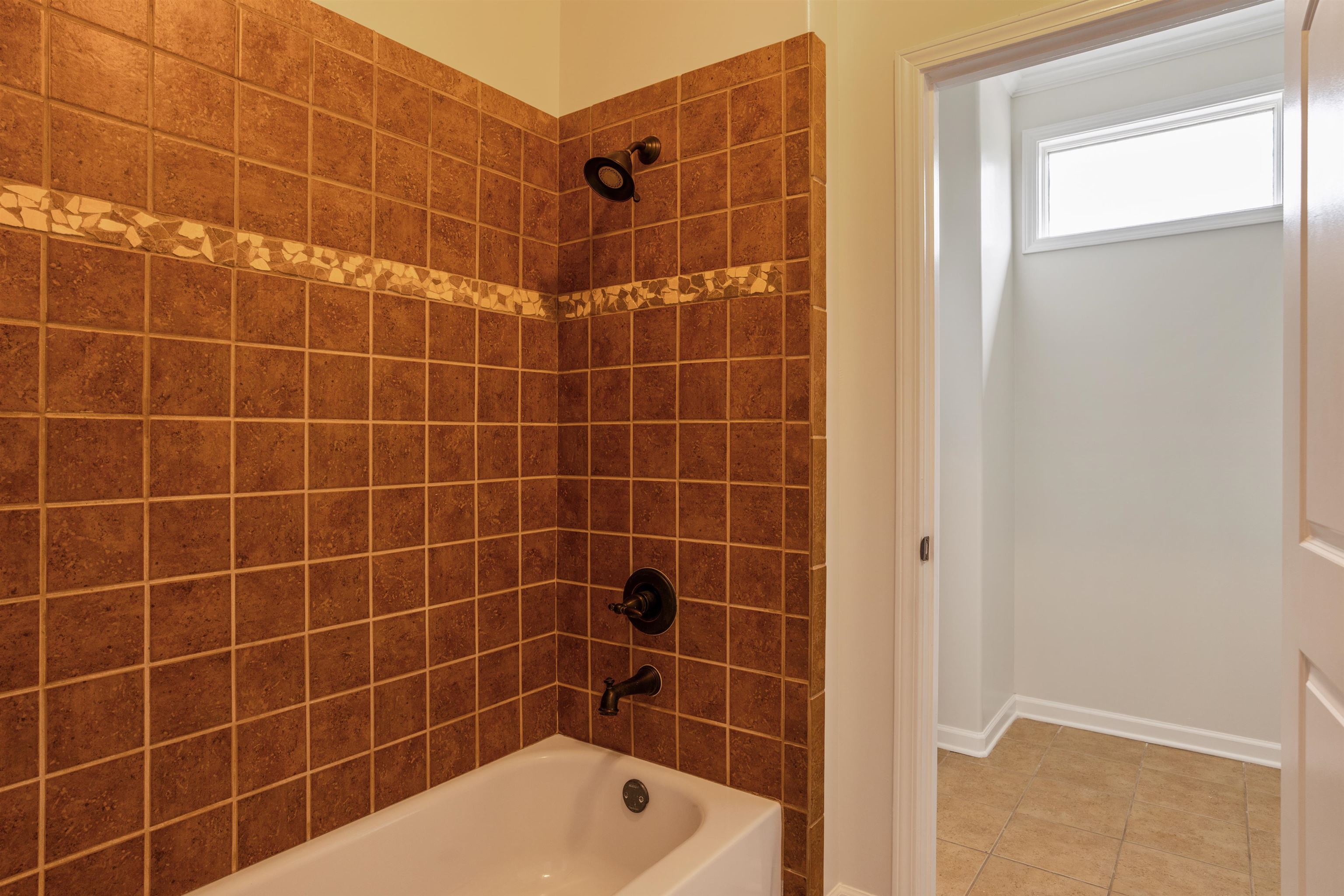 3485 East Taplow Way Collierville, TN 38017 - Photo 19 of 38 a bathroom with a bathtub