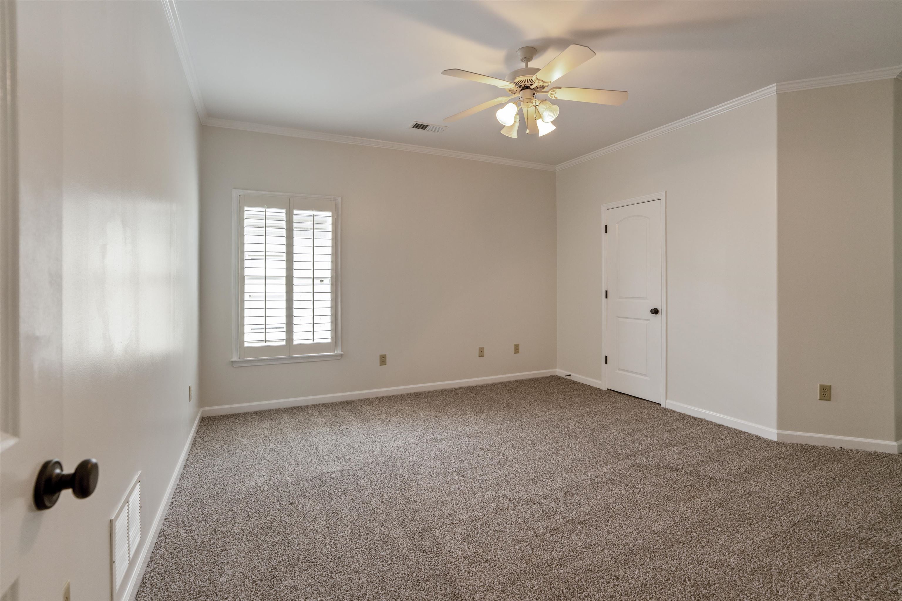 3485 East Taplow Way Collierville, TN 38017 - Photo 21 of 38 an empty room with windows and fan