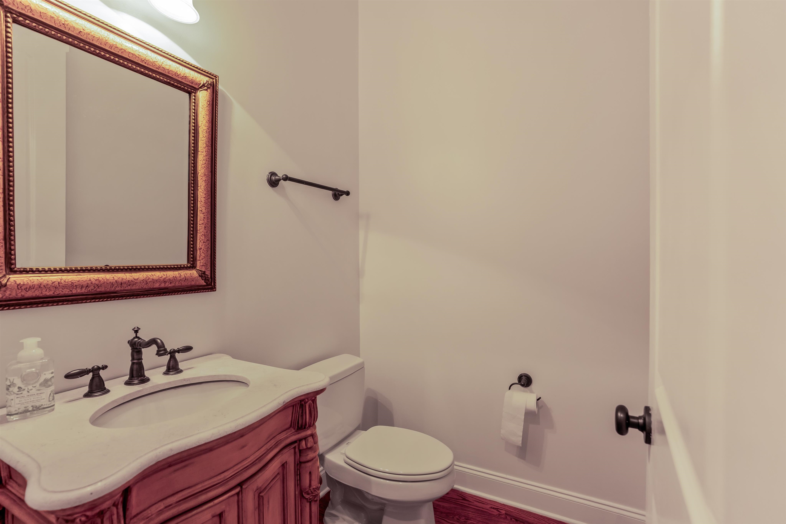 3485 East Taplow Way Collierville, TN 38017 - Photo 26 of 38 a bathroom with a sink vanity mirror and toilet