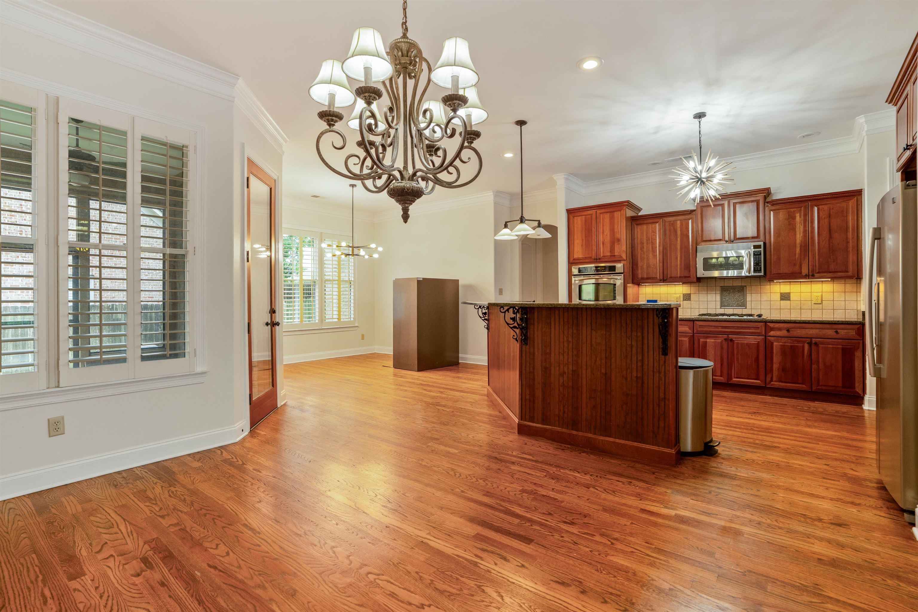 3485 East Taplow Way Collierville, TN 38017 - Photo 5 of 38 a view of a kitchen with furniture and a chandelier