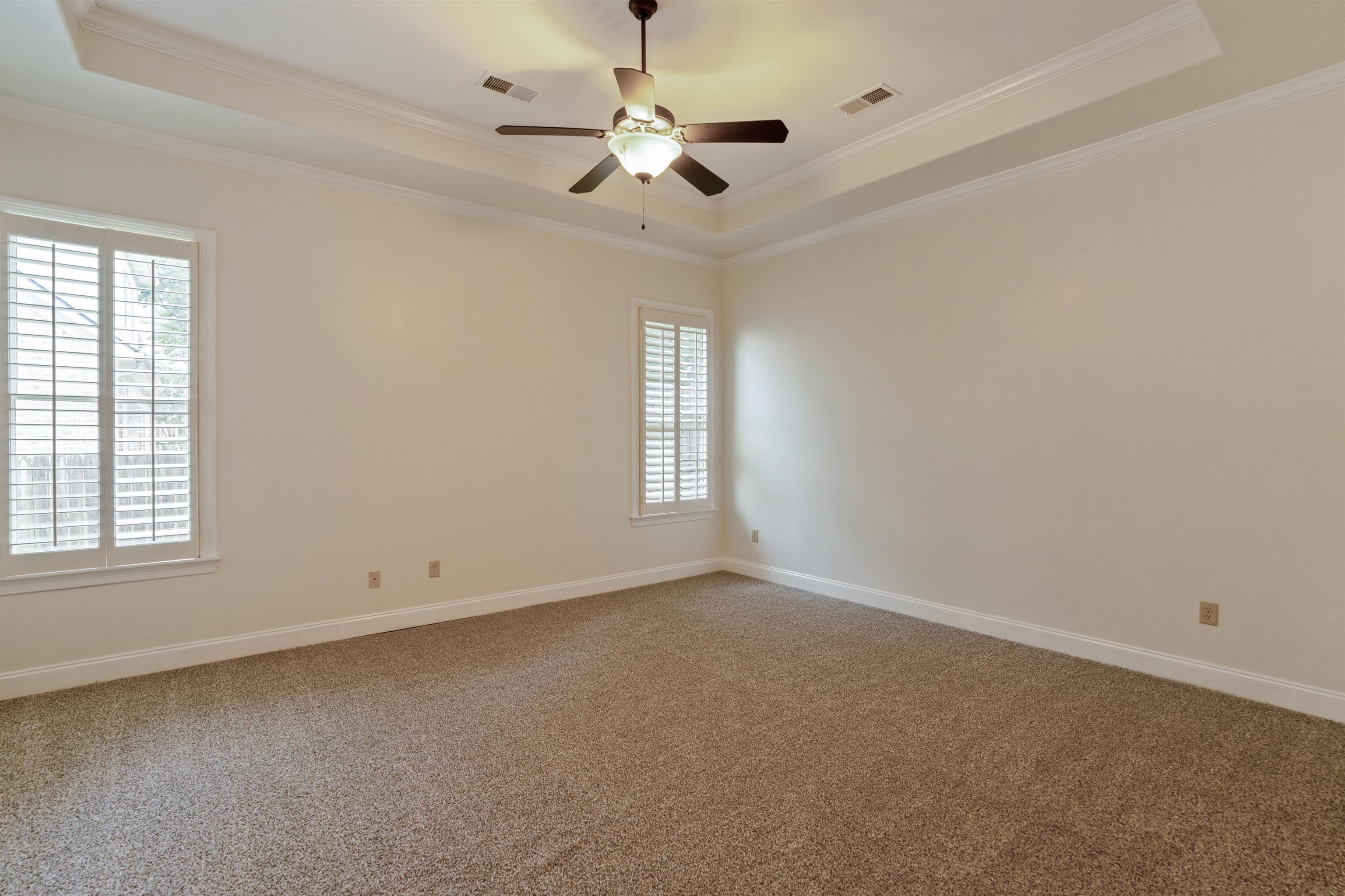 3485 East Taplow Way Collierville, TN 38017 - Photo 9 of 38 an empty room with windows and fan