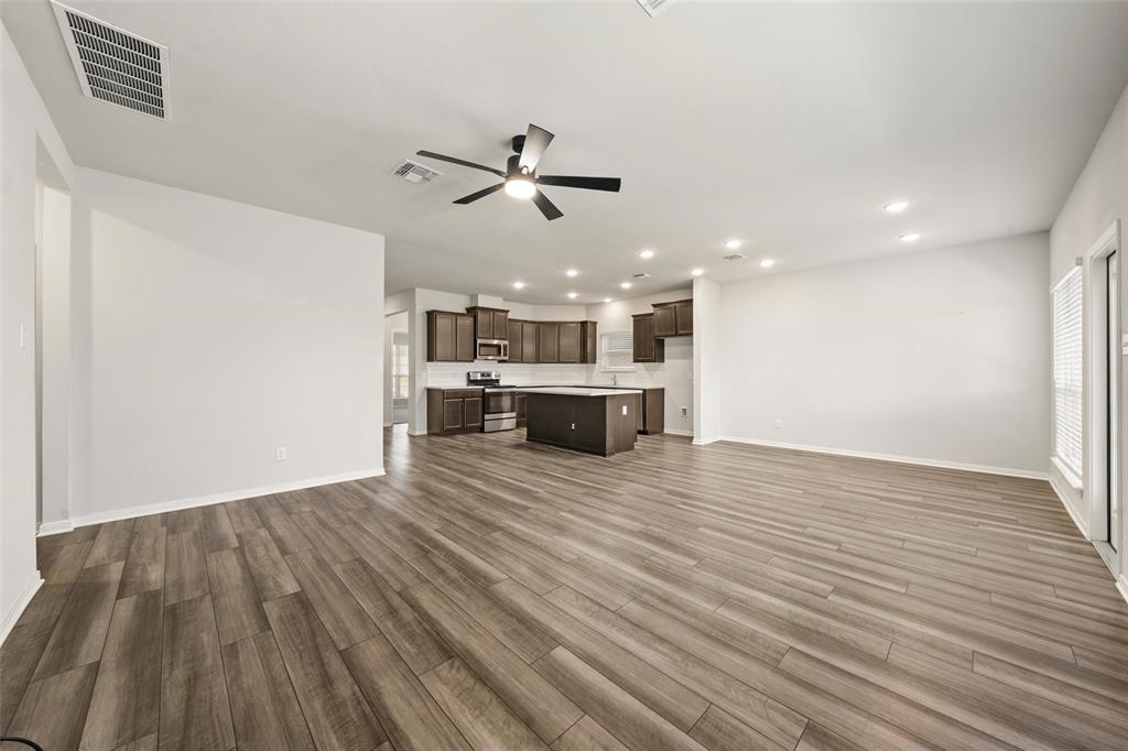 11304 Solar Street Lorena, TX 76655 - Photo 11 of 34 Unfurnished living room featuring recessed lighting, dark wood finished floors, and a ceiling fan