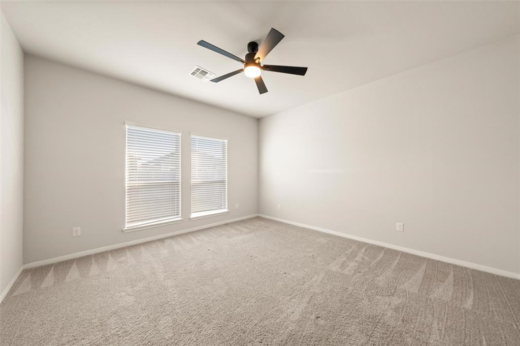 11304 Solar Street Lorena, TX 76655 - Photo 12 of 34 Unfurnished room with light carpet and ceiling fan